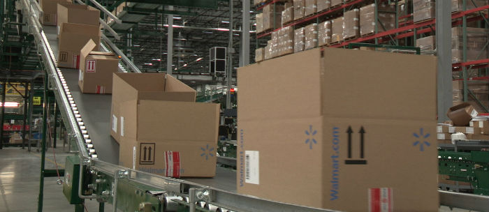 Walmart boxes on conveyor belt