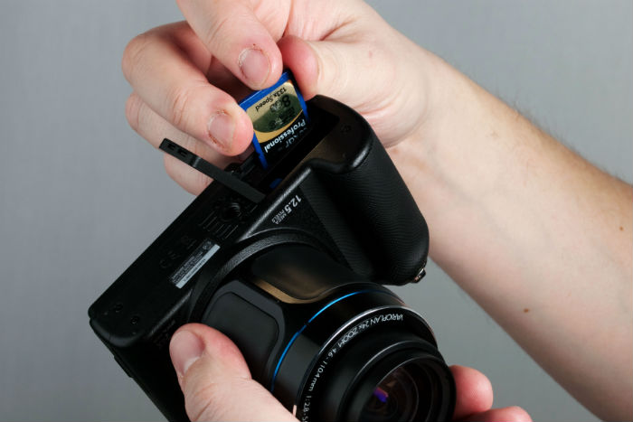 Inserting SD card into camera